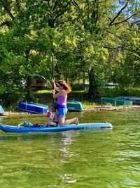 Side view of woman in water at park