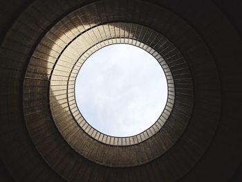 Low angle view of cooling tower of nuclear power plant against sky