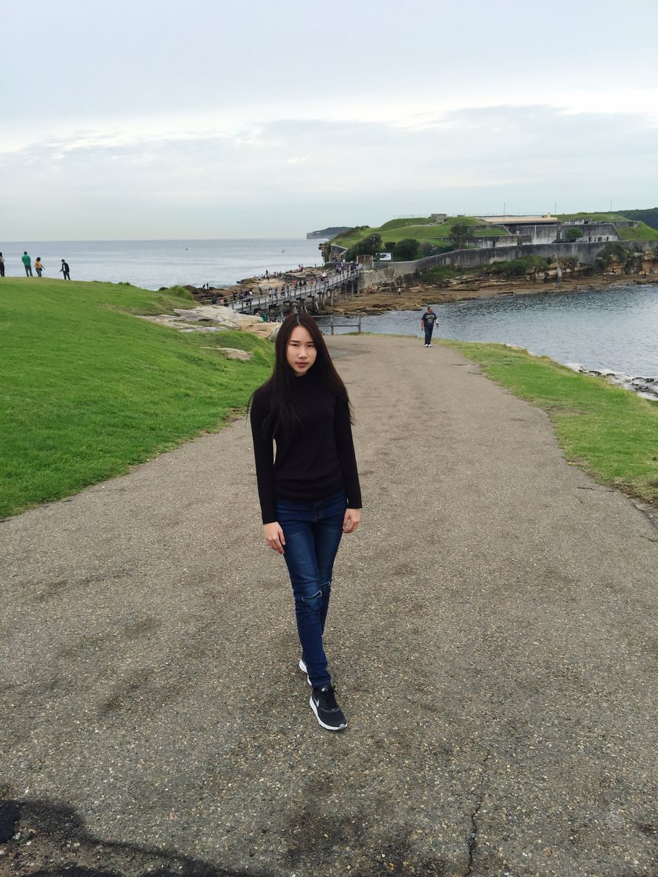 water, sea, lifestyles, beach, leisure activity, full length, sky, walking, casual clothing, standing, rear view, shore, horizon over water, tranquility, nature, person, day, tranquil scene