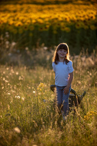 Full length portrait of woman on field