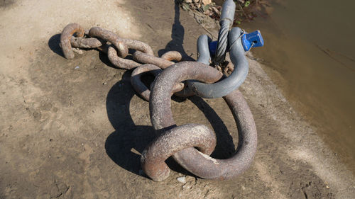 High angle view of chain on rock