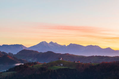 Scenic view of mountains against sky during sunset