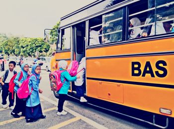 People on bus in city