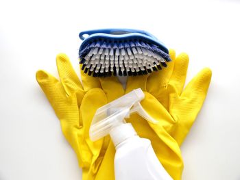 High angle view of yellow umbrella against white background