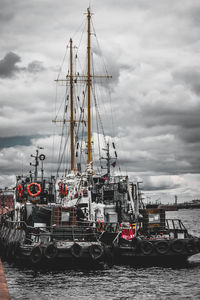 Boats moored at harbor