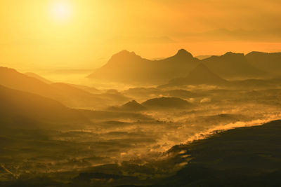 Scenic view of mountains against sky during sunset