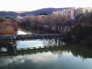 Bridge over river against sky