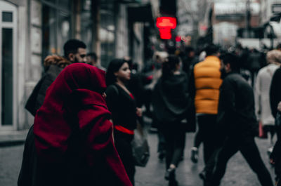 Group of people walking on city street