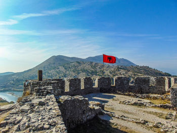 Scenic view of mountains against blue sky