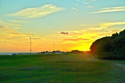 Scenic view of landscape against sky at sunset