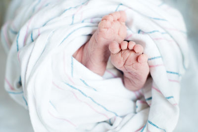 Close-up of hand touching baby