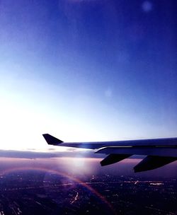 Airplane wing against sky