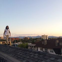 Man walking on rooftop 