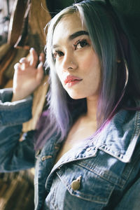 Close-up portrait of young woman looking away