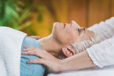 Close-up of woman getting massage at spa