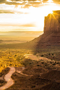 Scenic view of beach against sky during sunset