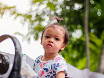 Portrait of cute girl outdoors