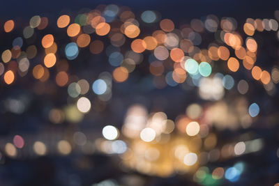 Defocused image of illuminated street lights at night