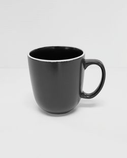 Close-up of coffee cup on white background