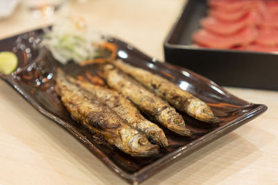 Close-up of meat in plate on table