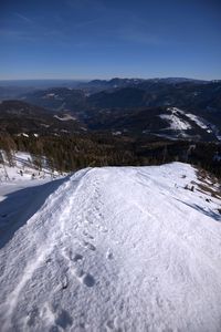 Scenic view of snow covered mountains against sky