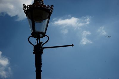 Low angle view of street light against sky