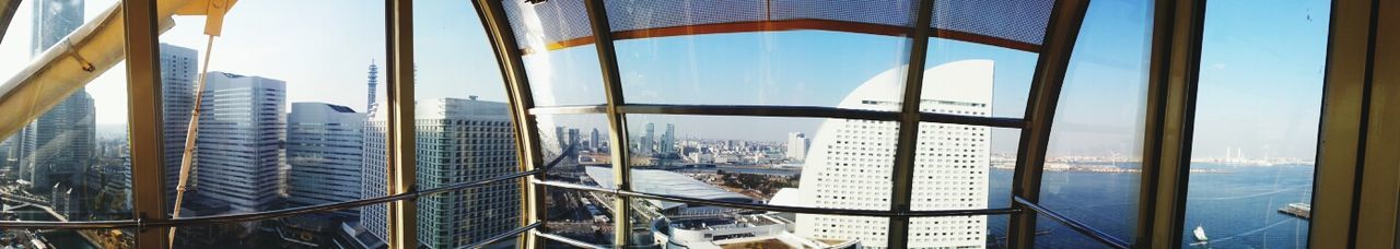 architecture, built structure, building exterior, city, glass - material, modern, office building, window, skyscraper, cityscape, transparent, indoors, reflection, sky, building, day, tall - high, tower, no people, glass