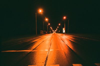 Illuminated road at night