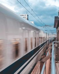 Train on railroad station platform against sky