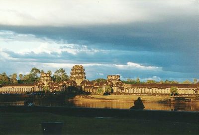 Building exterior against cloudy sky