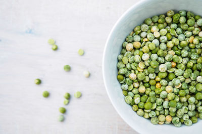 High angle view of green pea in bowl on table