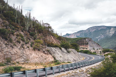 Scenic view of mountain road against sky