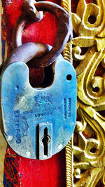 Close-up of padlocks on metal door