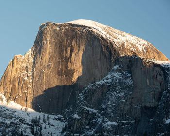 Scenic view of snowcapped mountains against clear sky