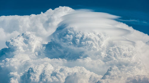 Exploding convection of a storm with pileus clouds.