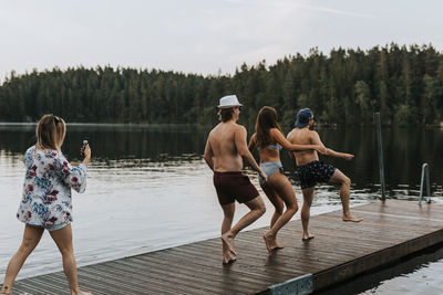 Friends having fun on jetty