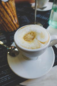 Close-up of coffee cup on table