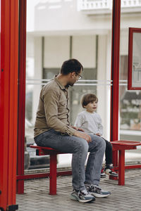 Rear view of mother and son