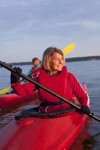 Two women kayaking on the sea