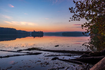 Scenic view of lake against sky during sunset