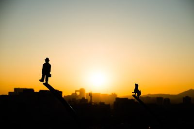 Silhouette of woman at sunset