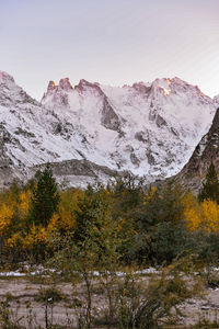 Scenic view of snowcapped mountains against sky