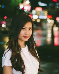 Portrait of young woman at night