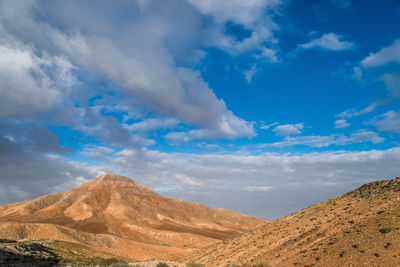 View of landscape against cloudy sky