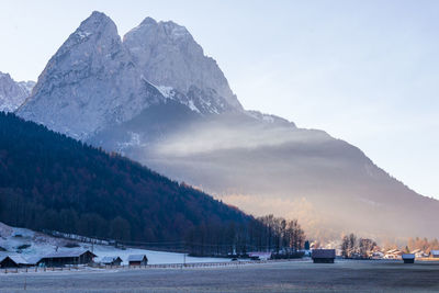 Scenic view of snowcapped mountains against sky