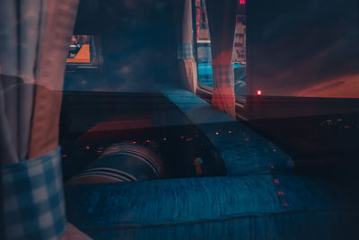 Sunset reflected on the window of a vintage van darkness and light