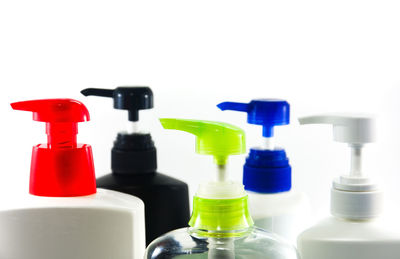 Close-up of bottles against white background