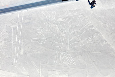 High angle view of person painting on snow
