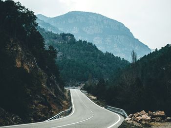 Road leading towards mountains