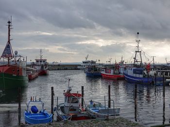 Boats moored at harbor